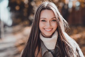 Smiling brunette woman with long, frizz-free hair